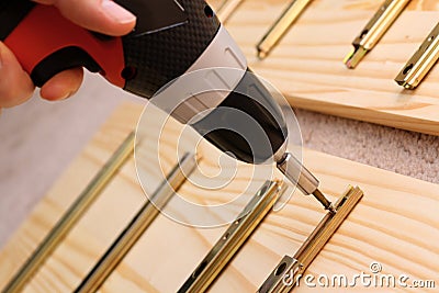 Mounting furniture with screwdriver Stock Photo