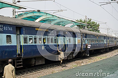 Mounting a moving train, India Editorial Stock Photo