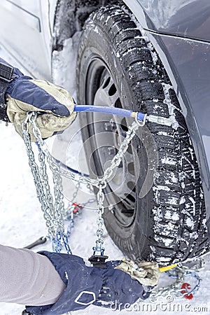 Mounting snow chains Stock Photo