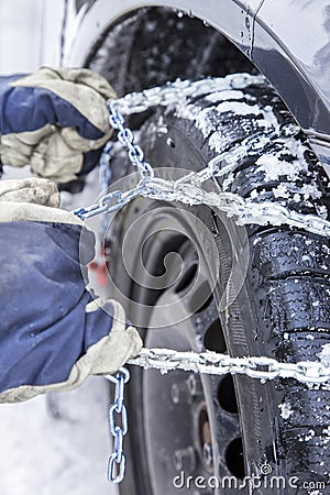 Mounting snow chains Stock Photo