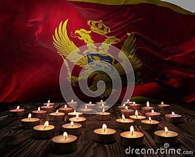 Mourning candles burning on Montenegro national flag of background. Memorial weekend, patriot veterans day, National Day of Cartoon Illustration