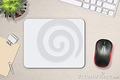Mouse pad mockup. White mat on the table with props, mouse and keyboard Stock Photo