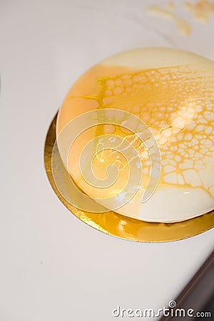 Mousse yogurt cake. A drawing of mousse on the cake. Frozen mirror icing on the cake. Culinary masterpieces Stock Photo