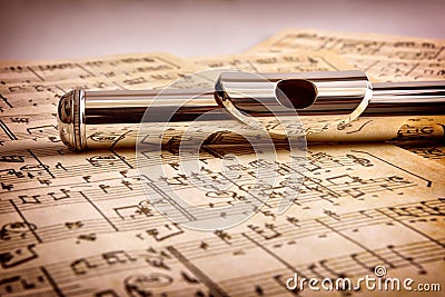 Mouthpiece of flute old handwritten sheet music front view Stock Photo