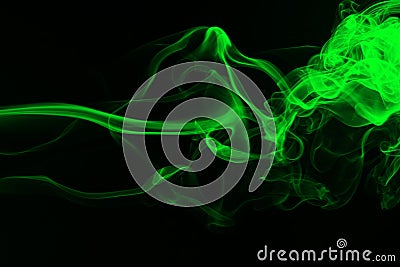 Green smoke abstract on black backgroud for design, darkness concept Stock Photo