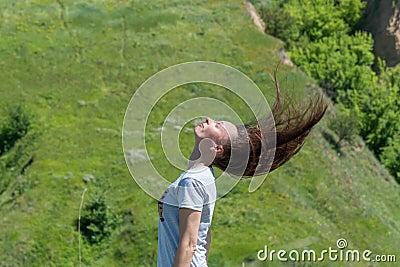 Movement raise on head hair up in the air. Portrait carefree woman. Stock Photo