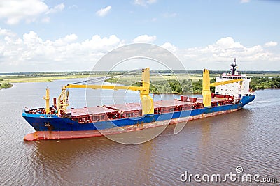 The movement of sea merchant ships and tugs to the entrance and exit from the port. Beaumont, Texas Stock Photo