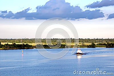 The movement of sea merchant ships and tugs to the entrance and exit from the port. Beaumont, Texas Stock Photo