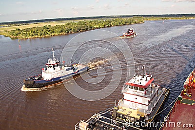 The movement of sea merchant ships and tugs to the entrance and exit from the port. Beaumont, Texas Stock Photo