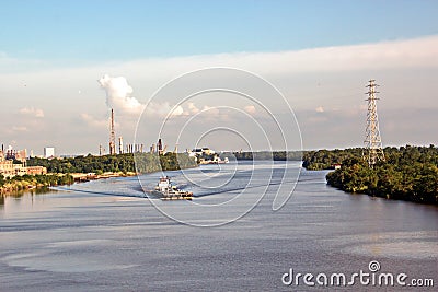 The movement of sea merchant ships and tugs to the entrance and exit from the port. Beaumont, Texas Stock Photo