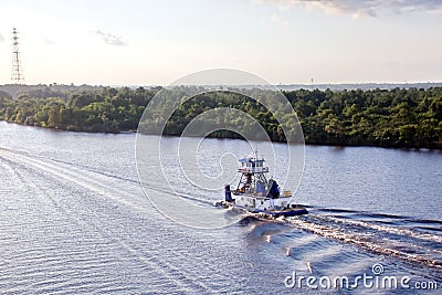 The movement of sea merchant ships and tugs to the entrance and exit from the port. Beaumont, Texas Stock Photo