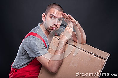 Mover man holding box making time out gesture Stock Photo