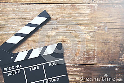 Movie clapper on wooden planks background Stock Photo