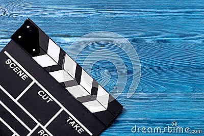 Movie clapperboard on blue wooden table background top view copyspace Stock Photo