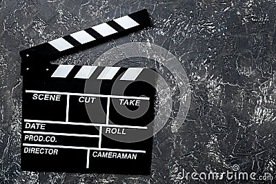 Movie clapperboard on grey stone table background top view copyspace Stock Photo