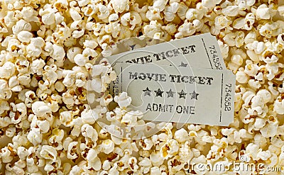 Movie tickets on popcorn snack background. Home theatre movie or series night concept. Flat lay top view from above Stock Photo