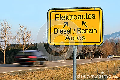 Moving away from diesel and petrol cars to electric cars on the road Stock Photo