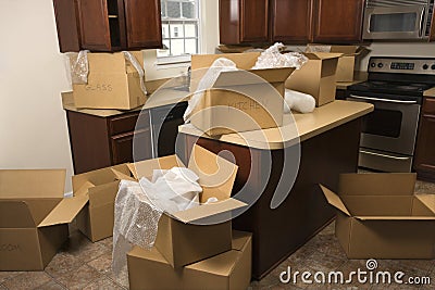 Moving boxes in kitchen. Stock Photo