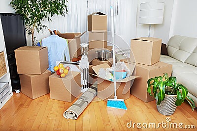 Moving boxes in new house. Stock Photo