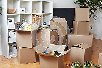 Moving boxes in new house. Stock Photo