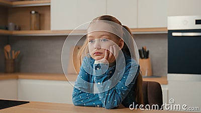 Moving camera sorrow grief worried little offended Caucasian sad upset bored child girl schoolgirl orphan unhappy lonely Stock Photo