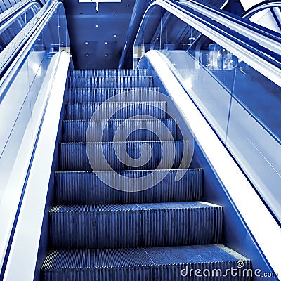 Moving escalator in the office hall Stock Photo