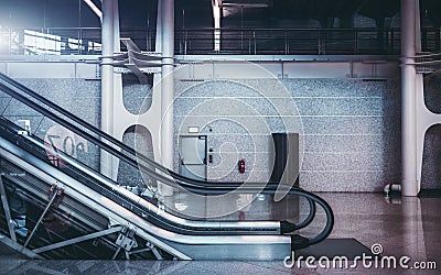 Moving staircase indoors of airport or shopping mall Stock Photo