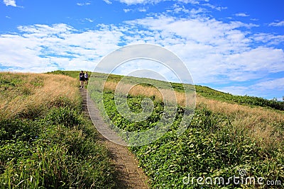 Pathway uphill with two women Stock Photo