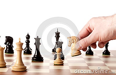 Moving white chess knight on a chessboard Stock Photo