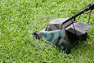 Mower Running in the grass Stock Photo