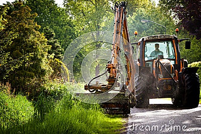 Mowing grass shoulder Stock Photo