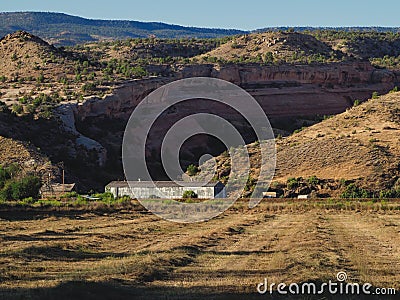 Mown Hayfield Beneath Red Rock Canyon Stock Photo