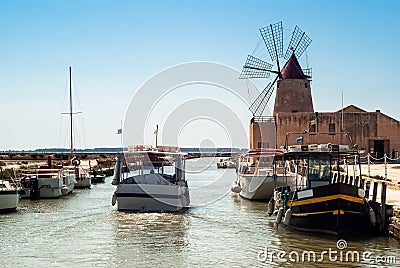 Mozia salt flats and an old windmill in Marsala, Sicily Stock Photo