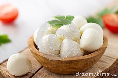 Mozzarella cheese in wooden bowl Stock Photo