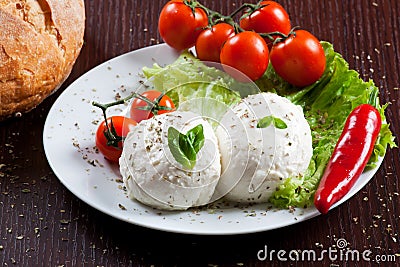 Mozzarella, vegetables and tomatoes Stock Photo