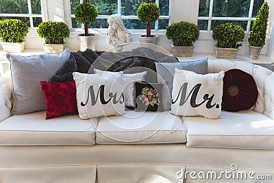 Mr and Mrs pillows on a couch at a wedding reception Stock Photo