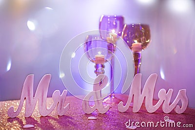 Mr. & Mrs. with Purple Goblet Candle Holders Stock Photo