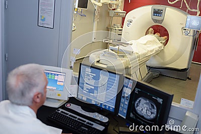 MRI technician surveying process Stock Photo