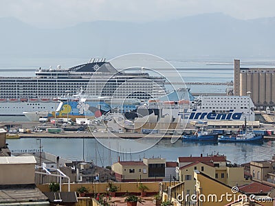 MSC Divina cruiseship and Tirrenia ferry moored at the harbour i Editorial Stock Photo