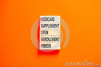 MSOEP symbol. Concept words MSOEP medicare supplement open enrollment period on wooden block. Beautiful orange background. Medical Stock Photo