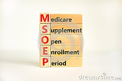 MSOEP symbol. Concept words MSOEP medicare supplement open enrollment period on wooden block. Beautiful white background. Medical Stock Photo