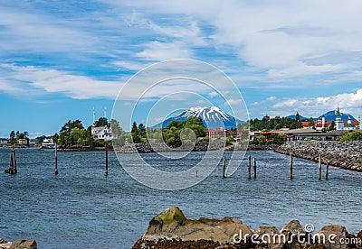 Mt Edgecumbe rises about the small town of Sitka in Alaska Stock Photo