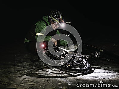 Extreme orienteering bike race. Cyclist check map Stock Photo