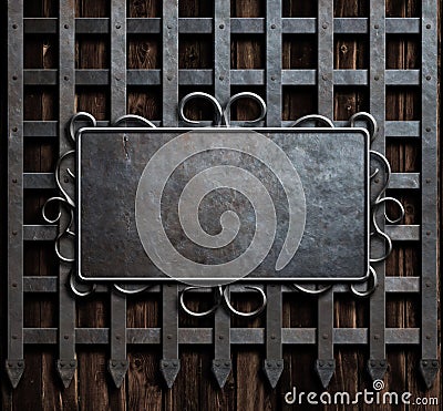 Mteal plate on medieval castle gate or wall background Stock Photo