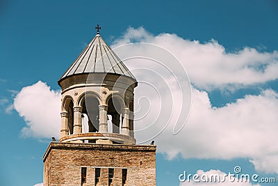 Mtskheta Georgia. Close Bell Tower Of Svetitskhoveli Cathedral Of Living Pillar, Blue Sky Background Stock Photo