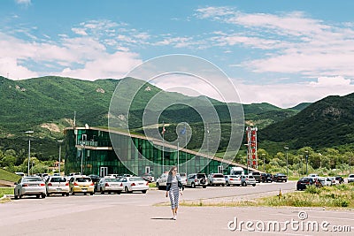 Mtskheta Georgia. Walking Young Woman. Building Of Police Station Editorial Stock Photo