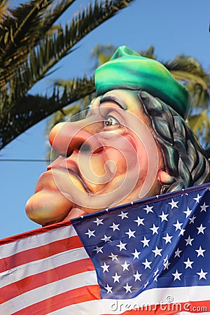 Muammar Gaddafi behind the American Flag Editorial Stock Photo