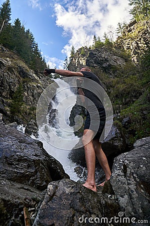 Muay thai fighter training by the waterfall Stock Photo