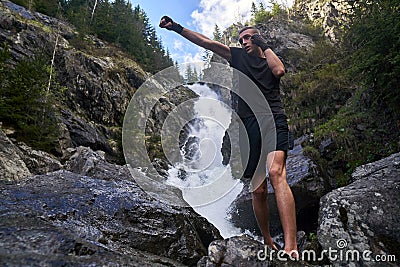 Muay thai fighter training by the waterfall Stock Photo