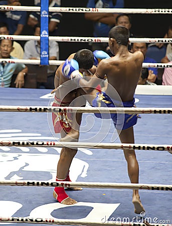 Muay Thai fighters compete in a Thai boxing match Editorial Stock Photo